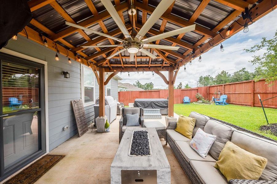 Alternate view of the covered pergola area.  The seller also added the storm door you see on the left, which allows you to leave the back door open so light can pour in, without worry of flies or mosquitoes getting in the house.