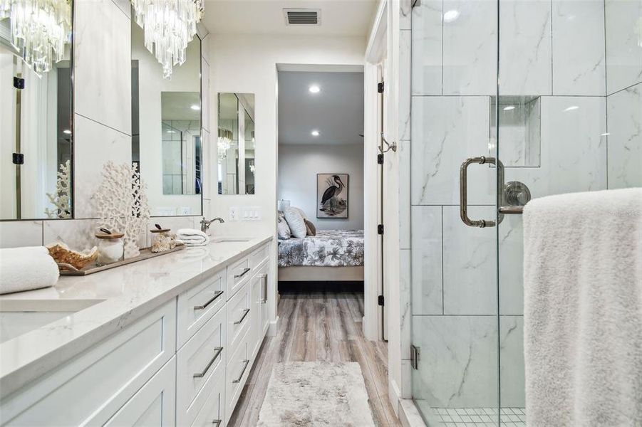 Primary bathroom. Dual sinks and built in-wall medicine cabinets, designer lighting.