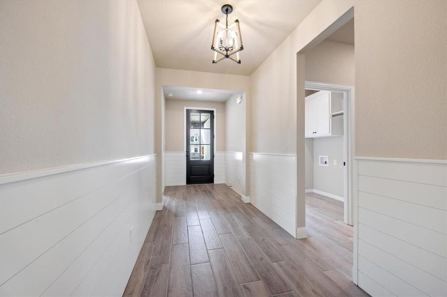 Entryway featuring a chandelier and hardwood / wood-style tile floors