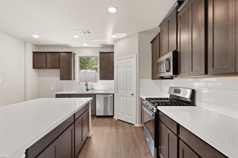 This kitchen is not only a functional space but also has ample storage. Whether you're a seasoned chef or just love to gather and enjoy good food, this kitchen is a dream come true.