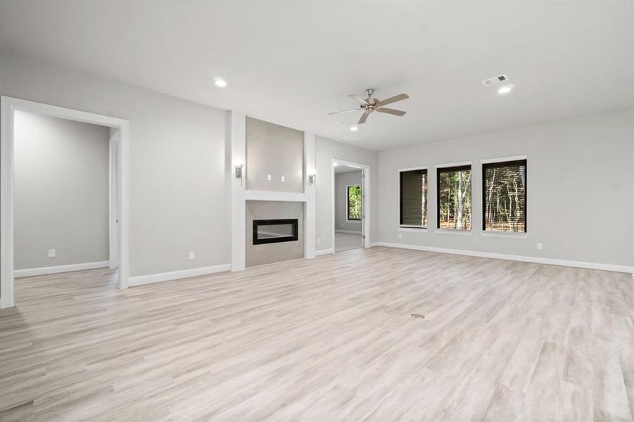 Extended covered patio overlooking the mature trees.