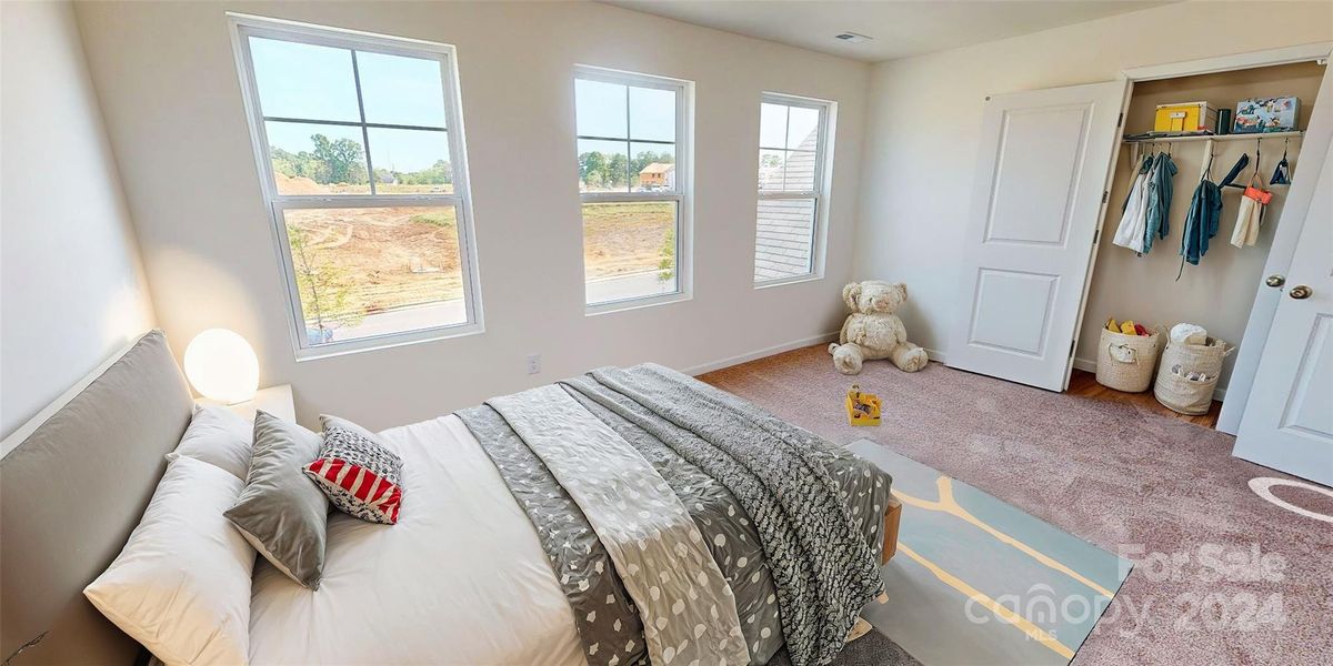 Secondary bedroom shown with virtual staging