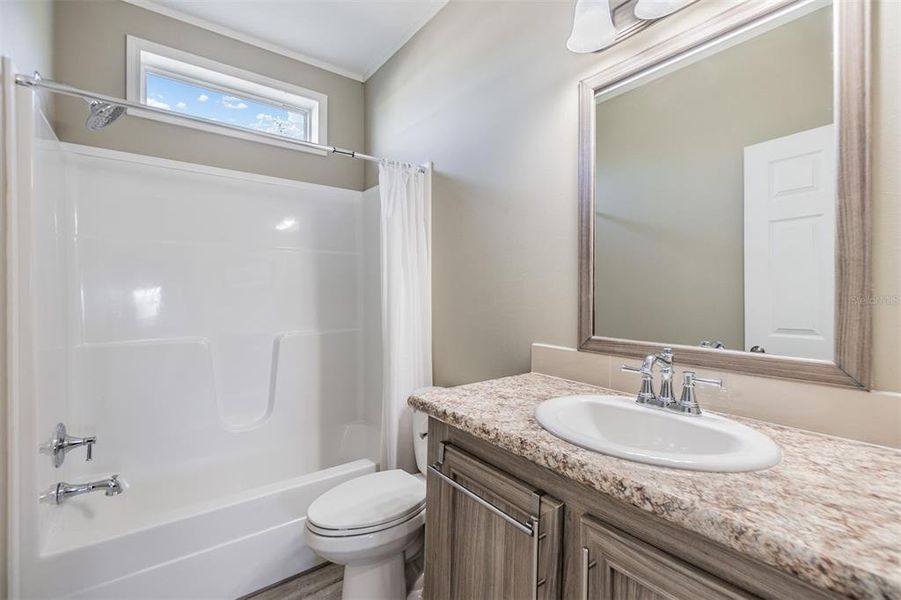 Guest bathroom with tub/shower combo