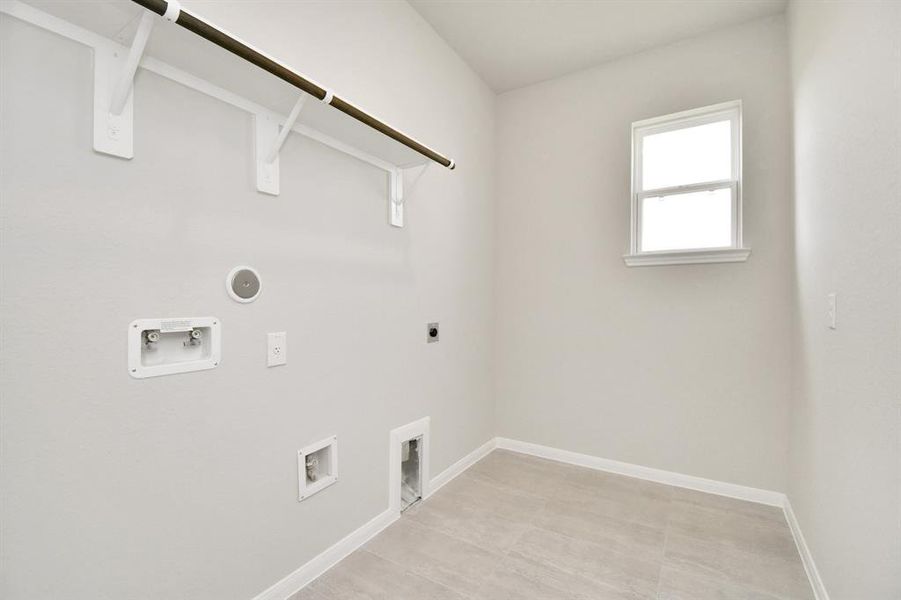 The laundry room featureswasher and dryer connections,and plenty of storage space.