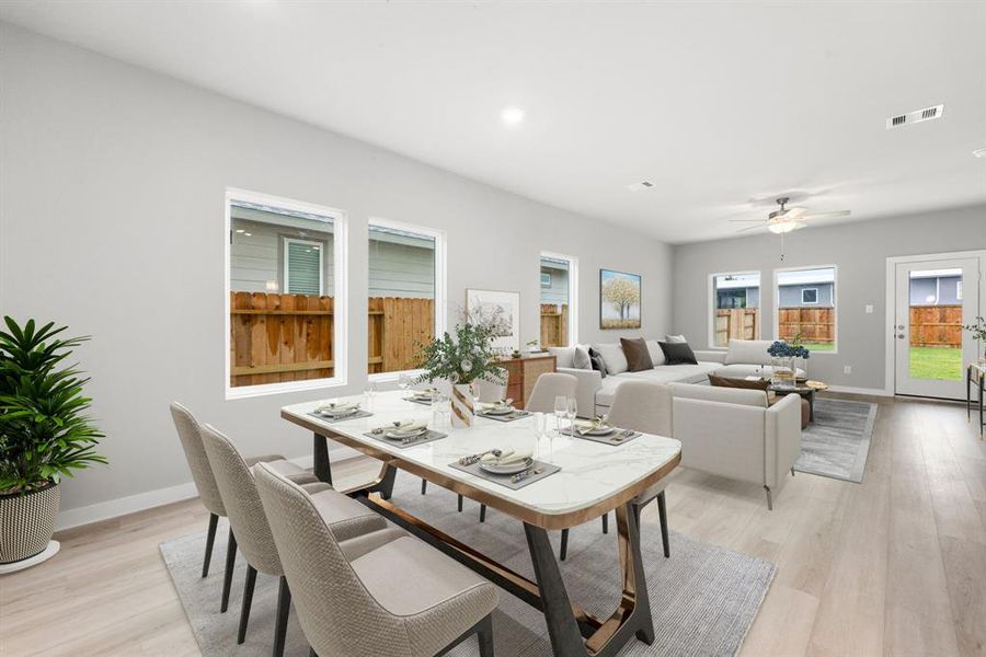 You and your guests will certainly dine in style in this amazing dining room! Featuring large windows, neutral paint, high ceilings, and luxury EVP flooring. Perfect space to entertain family and friends.