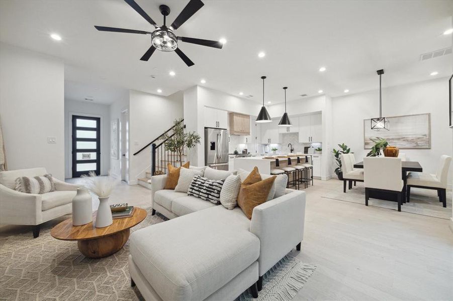 Another view of the expansive living space, kitchen, and dining area - Incredible opportunity for family, friends, and memories!