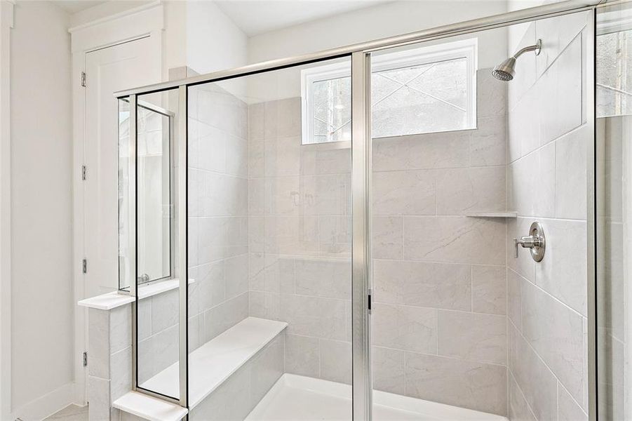 Bathroom featuring a shower with shower door