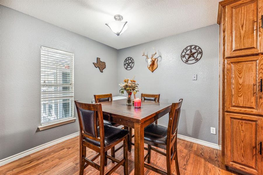 Dining space with wood-type flooring