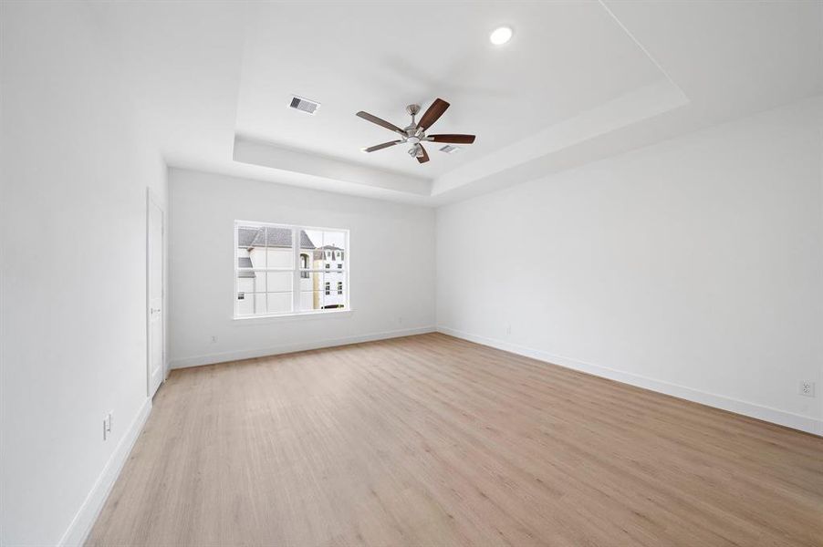 Spacious primary bedroom with two closets