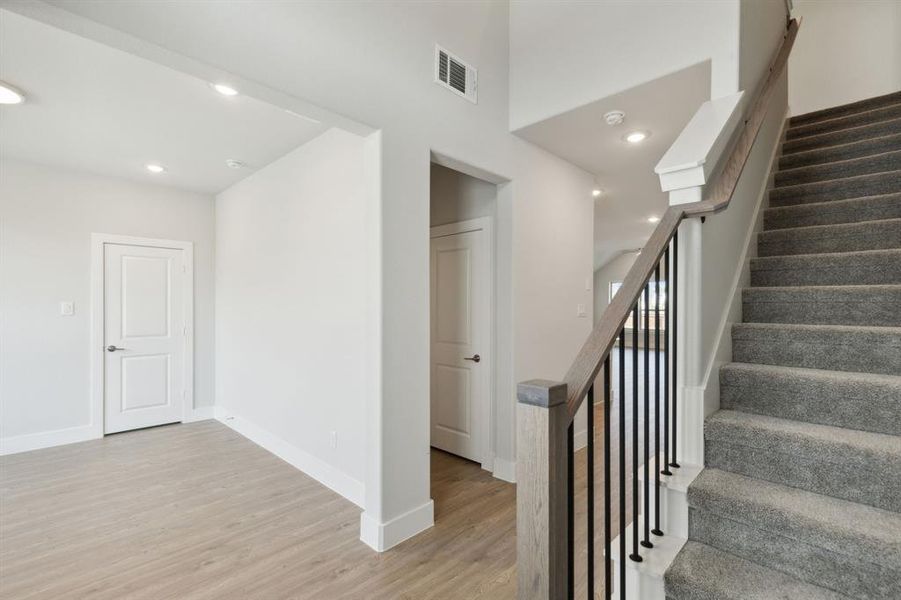 Staircase with wood-type flooring