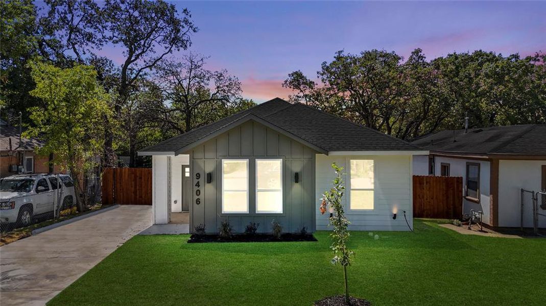 View of front of home with a lawn