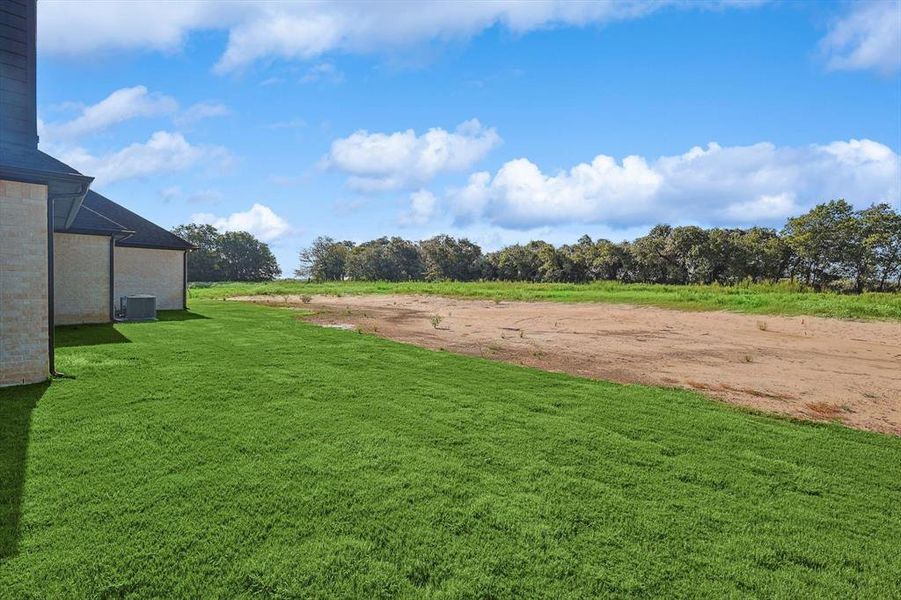 View of yard featuring central AC unit