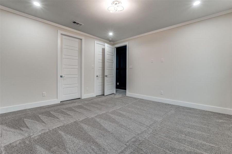 Beautiful guest bedroom with plenty of natural lighting.