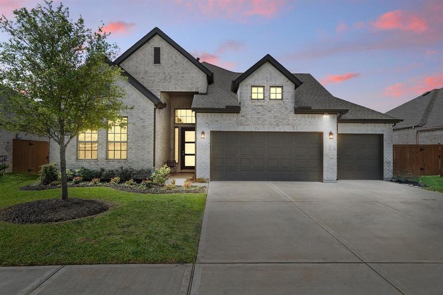 Welcome home to 624 Santa Rosa Hills Dr located on a quiet street in Sunterra and zoned to Katy ISD. This stunning home has lovely curb appeal, a well-manicured lawn, beautiful landscaping, and a triple wide driveway.