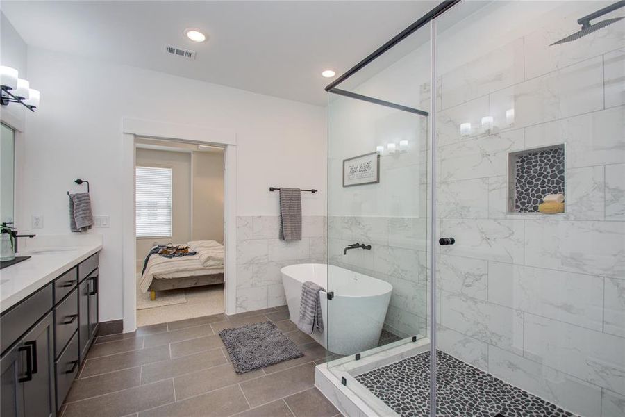 Primary bathroom! Model home photos - FINISHES AND LAYOUT MAY VARY!