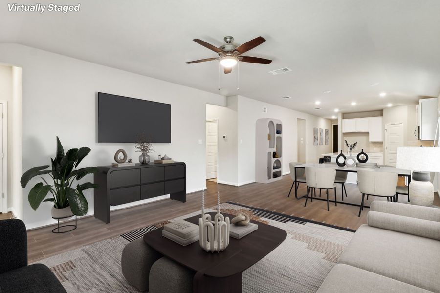 Virtually staged living room and dining room in the Hughes floorplan at a Meritage Homes community.