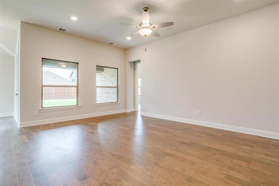 Unfurnished room featuring light hardwood / wood-style flooring and ceiling fan