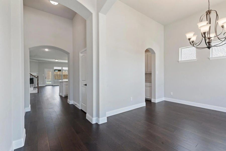 Dining Room to Foyer | Concept 3015 at Belle Meadows in Cleburne, TX by Landsea Homes