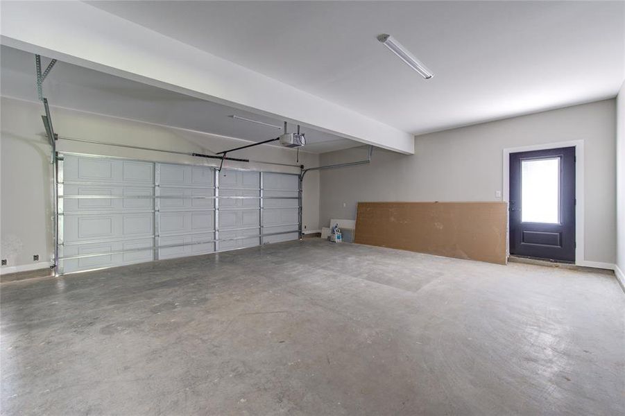 Oversized garage with upgraded door and garage door opener