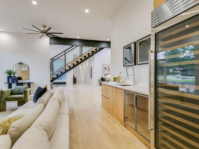 Formal dining boasts an elegant chandelier and overlooks the pool.