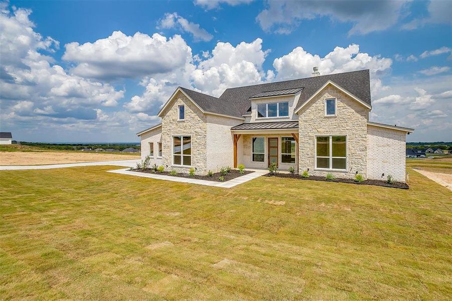 View of front of house with a front lawn