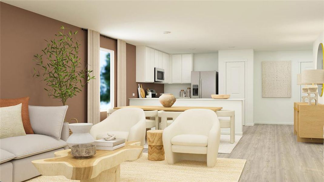 Kitchen featuring light hardwood / wood-style flooring, stainless steel appliances, and white cabinets