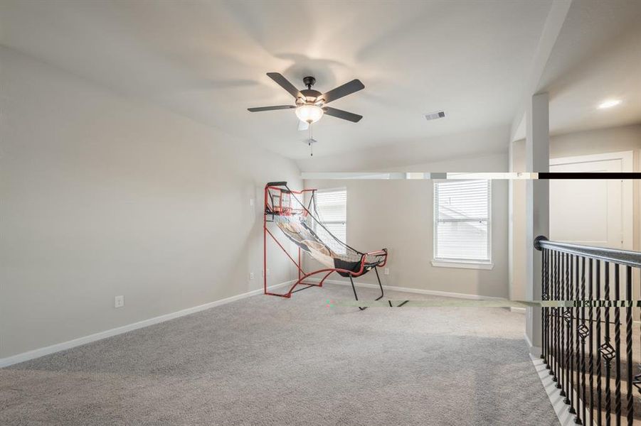 Game room area overlooks the living room downstairs