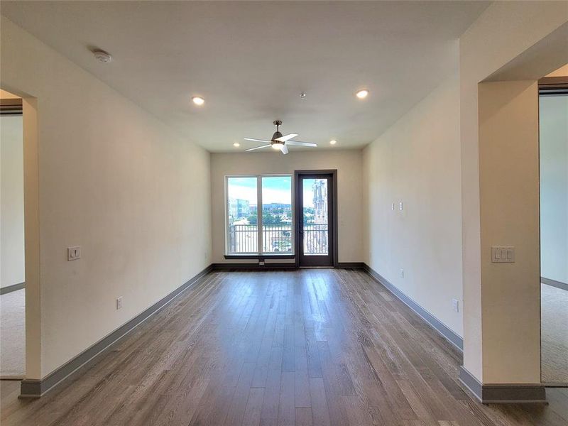Spare room featuring hardwood / wood-style floors and ceiling fan