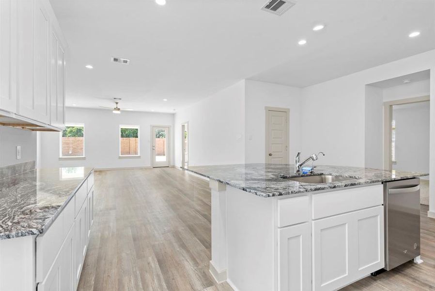 Huge Island has Deep Undermount Sink, Pull Out Kitchen Faucet and more! The Gourmet Kitchen flows into the Casual Dining and into the Huge Family Room all with Luxury wood like carefree vinyl floors! **Image Representative of Plan Only and May Vary as Built**
