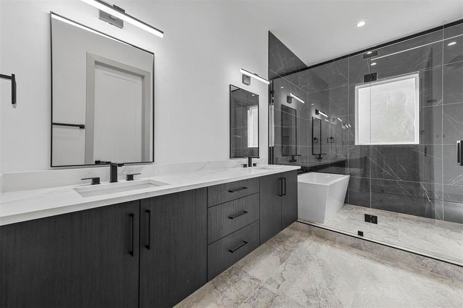Bathroom with dual vanity, shower with separate bathtub, and tile patterned floors