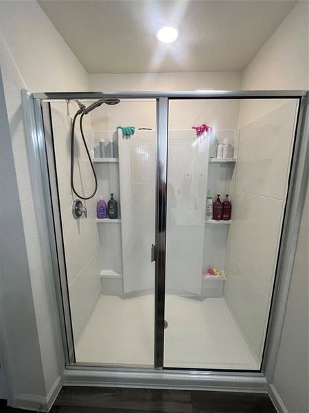 Bathroom with a shower with door