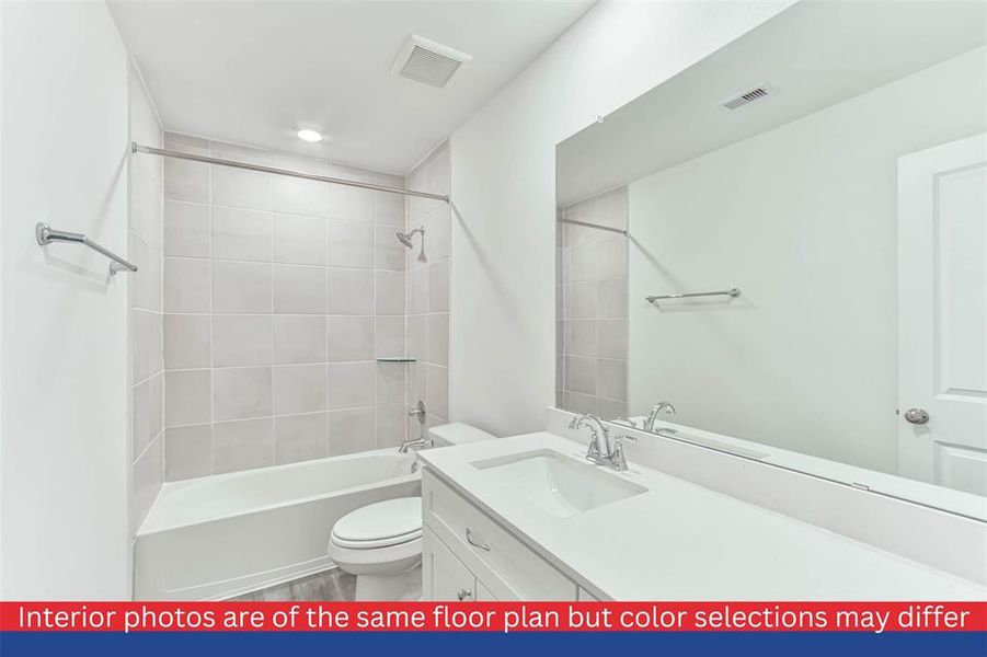 It also features an en-suite bathroom with a luxurious soaking tub, a separate shower, and a double vanity.