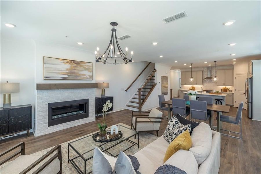 Living room featuring an inviting space to relax , with dark hardwood / wood-style flooring , and a Ventless Fireplace , not the actual unit