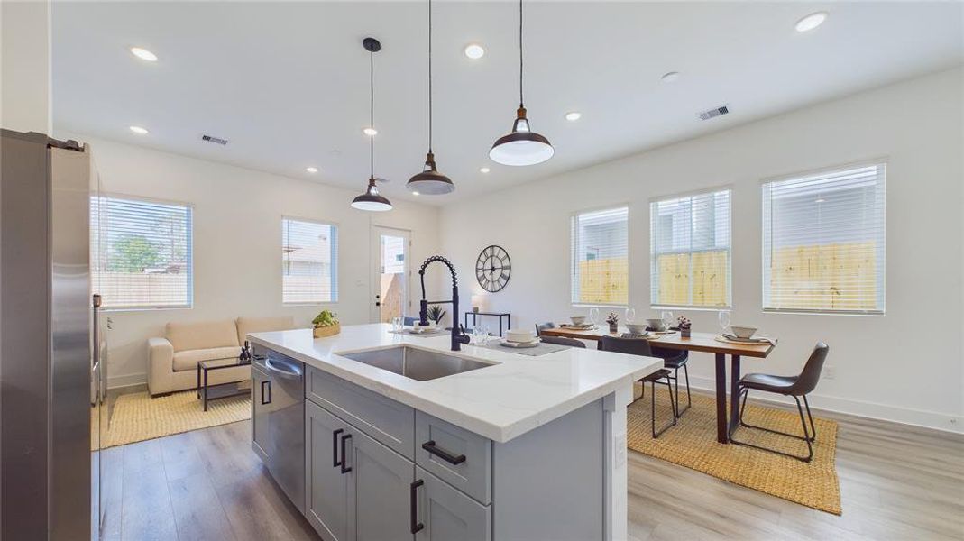 A large kitchen island is perfect for gatherings and food preparation.