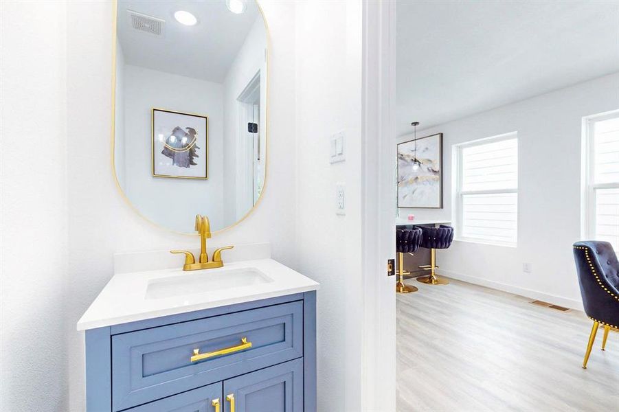 Bathroom featuring vanity and hardwood / wood-style floors