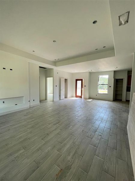 Unfurnished living room featuring hardwood / wood-style floors