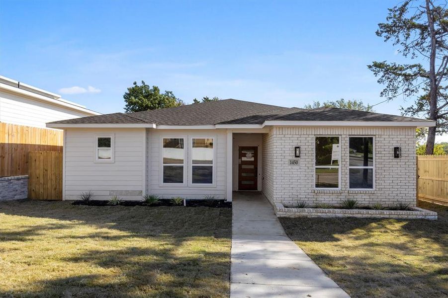 View of front of house with a front lawn