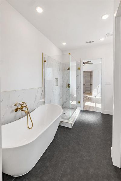 Bathroom with independent shower and bath and tile patterned floors