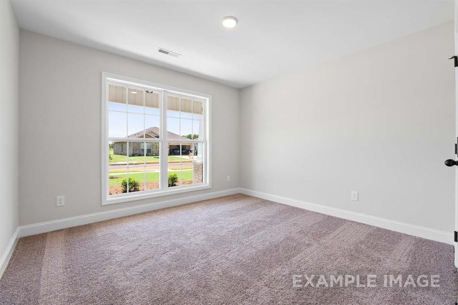 Spare room featuring carpet floors