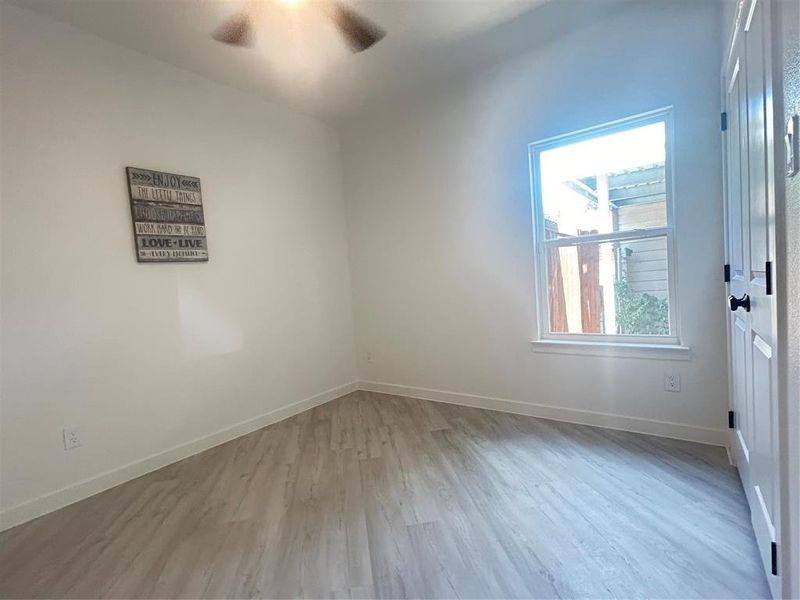 Empty room featuring ceiling fan and light hardwood / wood-style floors