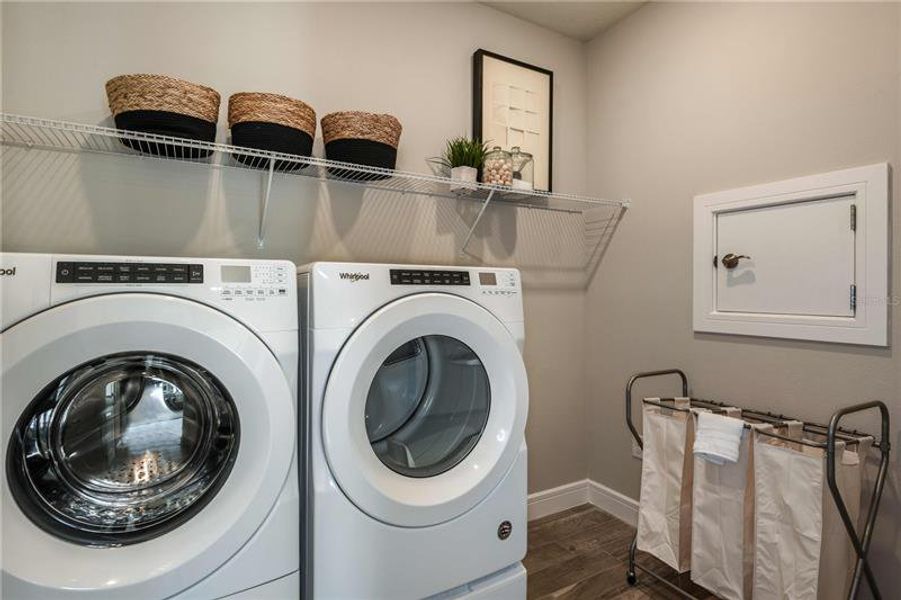 Laundry Room. Model home design. Pictures are for illustration purposes only. Elevations, colors and options may vary. Furniture is for model home only.