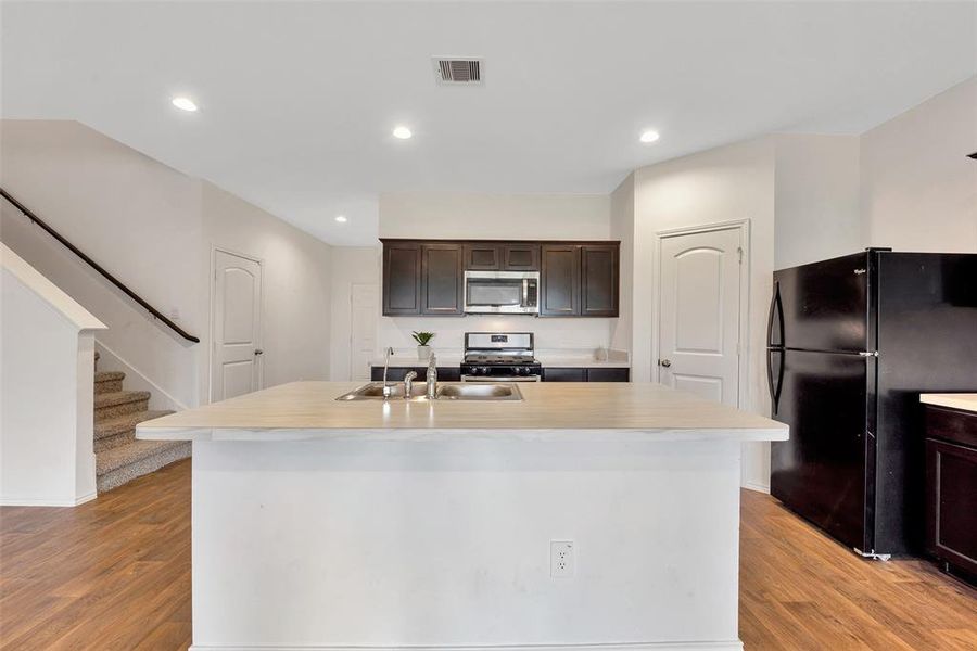 The kitchen has all the needed appliances. The door to the right opens to a nice sized pantry for additional storage.