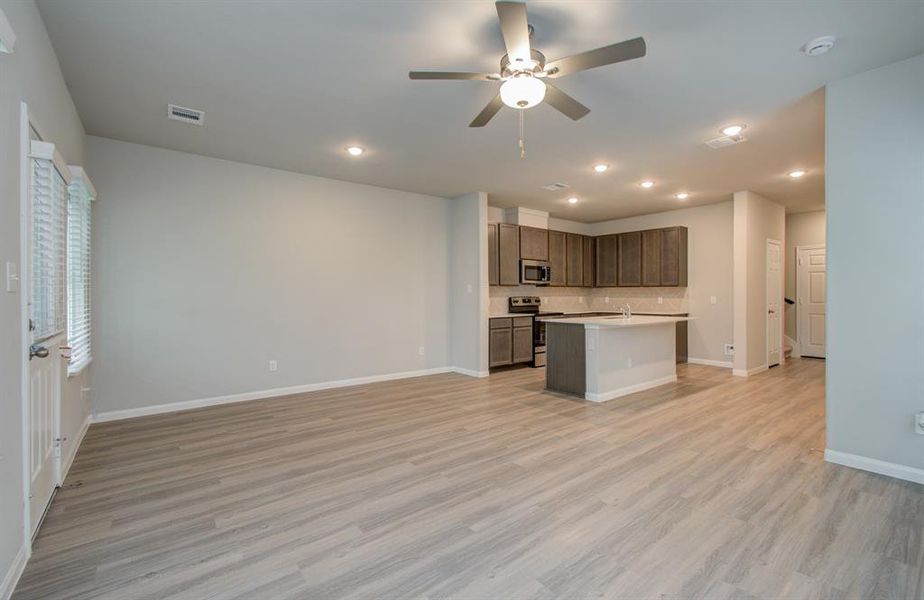 Open concept kitchen/dining/family room located on first floor