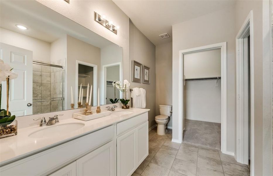 Owner's bath with dual vanity *Real Home pictured, former model.