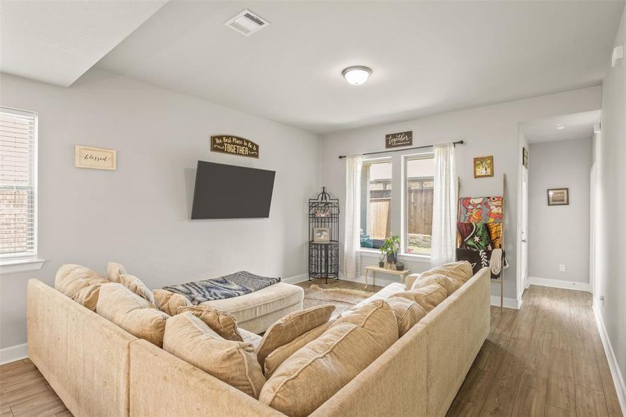 Living room featuring plenty of natural light and hardwood / wood-style floors