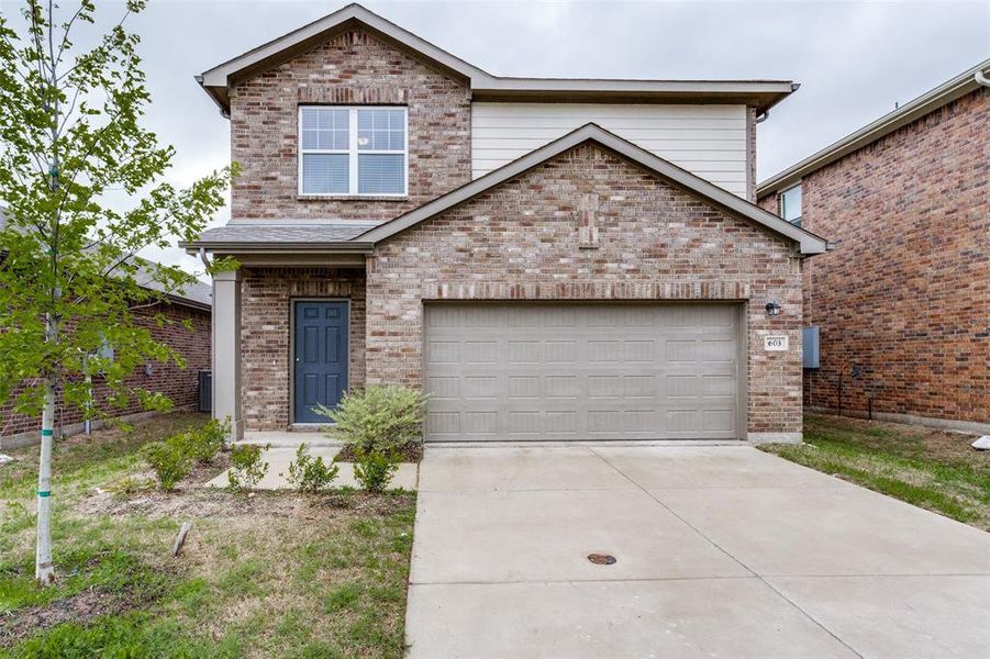 View of front property with a garage