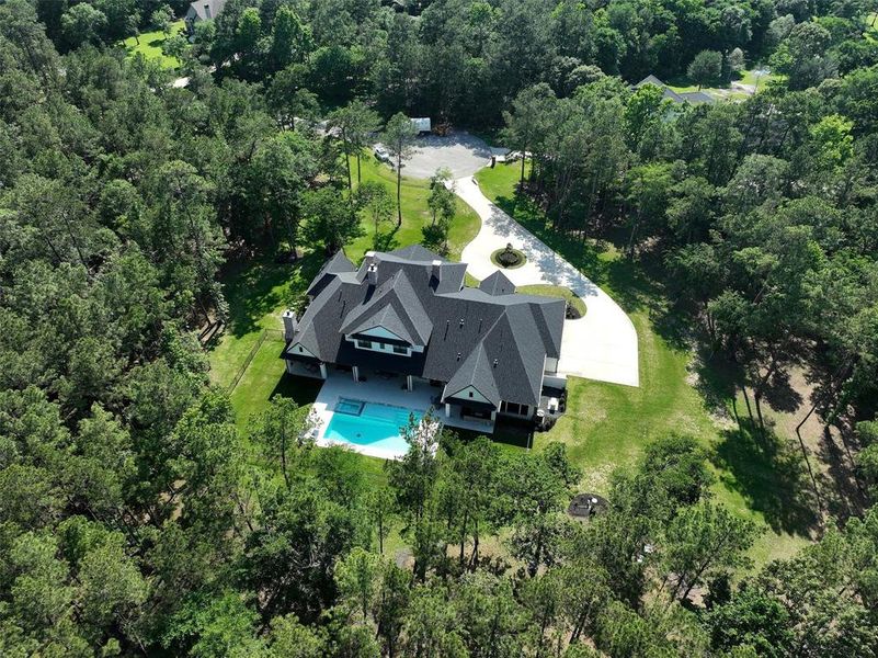 Another gorgeous aerial view of the back of the house! Enjoy the serenity of the totally private backyard, the grounds are impeccably maintained!