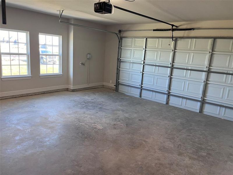 Garage featuring a garage door opener