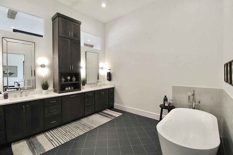 Spectacular second primary bathroom with lots of storage, dual sinks, and a soaking tub with seperate shower.