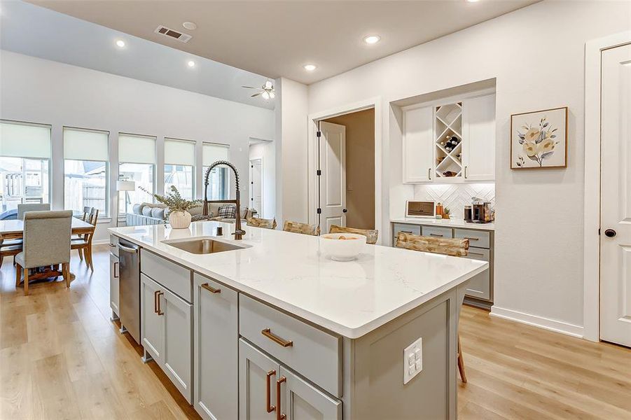 Stay connected to family and friends while cooking in this open concept layout.